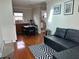 Cozy living room area adjacent to a small kitchen and featuring hardwood floors at 14147 Mailer Blvd, Orlando, FL 32828