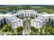 Aerial view of the complex, showcasing the building's unique architecture and landscaping at 14501 Grove Resort Ave # 3239, Winter Garden, FL 34787