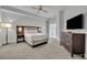 Modern bedroom featuring a comfortable bed, stylish furniture, and a large window at 14501 Grove Resort Ave # 3239, Winter Garden, FL 34787