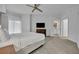 Bright bedroom with a comfortable bed, large window, and a flat screen TV, perfect for relaxation at 14501 Grove Resort Ave # 3239, Winter Garden, FL 34787