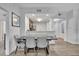 Dining area featuring a dining table, chairs and bench seating, with kitchen and hallway views at 14501 Grove Resort Ave # 3239, Winter Garden, FL 34787