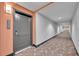 Hallway view with modern carpet and lighting, plus condo number at 14501 Grove Resort Ave # 3239, Winter Garden, FL 34787