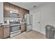 Clean kitchen design with stainless steel appliances, modern cabinets, and functional layout at 14501 Grove Resort Ave # 3239, Winter Garden, FL 34787
