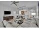 Cozy living room featuring modern furniture, neutral colors, and direct access to the dining area at 14501 Grove Resort Ave # 3239, Winter Garden, FL 34787
