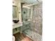 Modern bathroom featuring a stylish glass-enclosed shower and vessel sink with unique tile work at 151 E Washington St # 508, Orlando, FL 32801