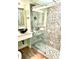 Updated bathroom with glass enclosed shower and decorative tile at 151 E Washington St # 508, Orlando, FL 32801