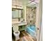 Charming bathroom with vibrant blue bathtub and modern fixtures, offering a unique and comfortable space at 151 E Washington St # 508, Orlando, FL 32801
