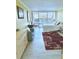 Bright bedroom featuring a large window, comfortable bed, and a cozy seating area with ample storage at 151 E Washington St # 508, Orlando, FL 32801