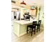 Well-lit kitchen with updated appliances, breakfast bar, and stylish light fixtures for a modern feel at 151 E Washington St # 508, Orlando, FL 32801