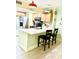 Stylish kitchen with stainless steel appliances, quartz countertop, and breakfast bar at 151 E Washington St # 508, Orlando, FL 32801