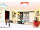 Cozy living room adjacent to the kitchen with a comfortable couch and bright lighting at 151 E Washington St # 508, Orlando, FL 32801