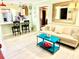 A vibrant living space offering a kitchen with breakfast bar and comfortable sitting area with unique decor at 151 E Washington St # 508, Orlando, FL 32801