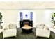 Warm and inviting lobby with a fireplace, comfortable seating, and stylish design elements at 151 E Washington St # 508, Orlando, FL 32801