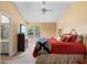 Spacious bedroom featuring an ensuite bathroom, tv, and large window at 1529 Farrindon Cir, Lake Mary, FL 32746
