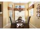 Cozy dining area with natural light and chandelier at 1529 Farrindon Cir, Lake Mary, FL 32746