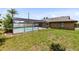 A spacious backyard featuring a screened pool, perfect for outdoor gatherings and relaxation at 1736 Saxon Blvd, Deltona, FL 32725