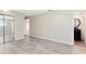 Large bedroom featuring neutral walls, tile flooring, and ensuite bathroom at 1736 Saxon Blvd, Deltona, FL 32725