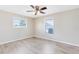 Bedroom showcasing neutral walls, base trim, and new flooring at 1736 Saxon Blvd, Deltona, FL 32725