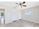 Bedroom featuring neutral walls, a ceiling fan, and a window at 1736 Saxon Blvd, Deltona, FL 32725