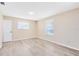 Bedroom showcasing neutral walls, base trim, and new flooring at 1736 Saxon Blvd, Deltona, FL 32725