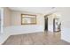 Neutral toned dining room with light colored wood floors and white trim at 1736 Saxon Blvd, Deltona, FL 32725