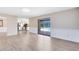 Bright living room with light wood floors and sliding doors to the pool area at 1736 Saxon Blvd, Deltona, FL 32725