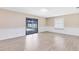 Open-concept living room with sliding glass door leading to backyard at 1736 Saxon Blvd, Deltona, FL 32725