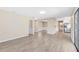 Open-concept living area with light wood flooring, neutral walls, and recessed lighting at 1736 Saxon Blvd, Deltona, FL 32725
