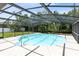 Enjoy this screened pool with its bright blue water and a refreshing dip in your backyard oasis at 1736 Saxon Blvd, Deltona, FL 32725