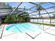 Enjoy this screened pool with its bright blue water and a refreshing dip in your backyard oasis at 1736 Saxon Blvd, Deltona, FL 32725