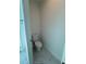 A toilet is tucked in the corner on top of stylish marble floor tiles at 1754 35Th Nw St, Winter Haven, FL 33881