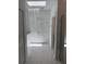 Bright bathroom with marble floors, skylight, walk-in shower, and double closets at 1754 35Th Nw St, Winter Haven, FL 33881