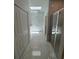 Bright bathroom featuring marble floors, skylight, walk-in shower, and storage at 1754 35Th Nw St, Winter Haven, FL 33881