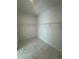 A walk-in closet features wire shelving and white marble tile flooring at 1754 35Th Nw St, Winter Haven, FL 33881