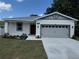 Well manicured single story home with a two car garage and fresh landscaping at 1754 35Th Nw St, Winter Haven, FL 33881