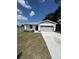 Charming single story home with a well manicured lawn and concrete driveway to a two car garage at 1754 35Th Nw St, Winter Haven, FL 33881