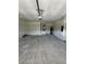 The large garage features high ceilings and a door to the interior at 1754 35Th Nw St, Winter Haven, FL 33881