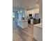 Bright kitchen with an island, pendant lighting, stainless steel appliances, and sleek white cabinetry at 1754 35Th Nw St, Winter Haven, FL 33881