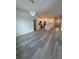 Open floorplan showcasing a living room and kitchen, with modern lighting and neutral walls at 1754 35Th Nw St, Winter Haven, FL 33881