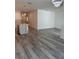Spacious living room adjacent to the kitchen, featuring modern light fixtures and neutral decor at 1754 35Th Nw St, Winter Haven, FL 33881