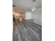 Open floorplan showcasing the kitchen and living room, with recessed lighting and wood-look flooring at 1754 35Th Nw St, Winter Haven, FL 33881