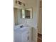 Well-lit bathroom featuring a vanity with a white countertop and modern fixtures and mirrors at 1791 Iroquois Dr, Apopka, FL 32703