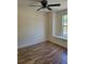 Inviting bedroom featuring wood-look flooring, neutral paint, and a ceiling fan at 1791 Iroquois Dr, Apopka, FL 32703