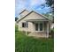 Charming home featuring a covered patio with double doors and manicured lawn at 1791 Iroquois Dr, Apopka, FL 32703