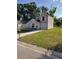 Charming two-story home with neutral vinyl siding, white trim, green lawn, and a one-car garage at 1791 Iroquois Dr, Apopka, FL 32703