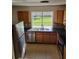 Functional kitchen featuring stainless steel appliances, tiled backsplash, and plenty of cabinet space at 1791 Iroquois Dr, Apopka, FL 32703