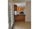 Open kitchen design with breakfast bar overlooking adjacent living area with rear access at 1791 Iroquois Dr, Apopka, FL 32703