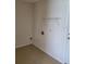 Functional laundry room with tile flooring and hookups for a washer and dryer at 1791 Iroquois Dr, Apopka, FL 32703