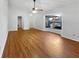 Sunny living room with hardwood floors and large bay windows at 1818 Portview Ave, Deltona, FL 32738
