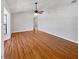 Bright living room with hardwood floors, ceiling fan, and large windows at 1818 Portview Ave, Deltona, FL 32738